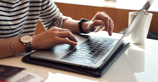 Typing on laptop